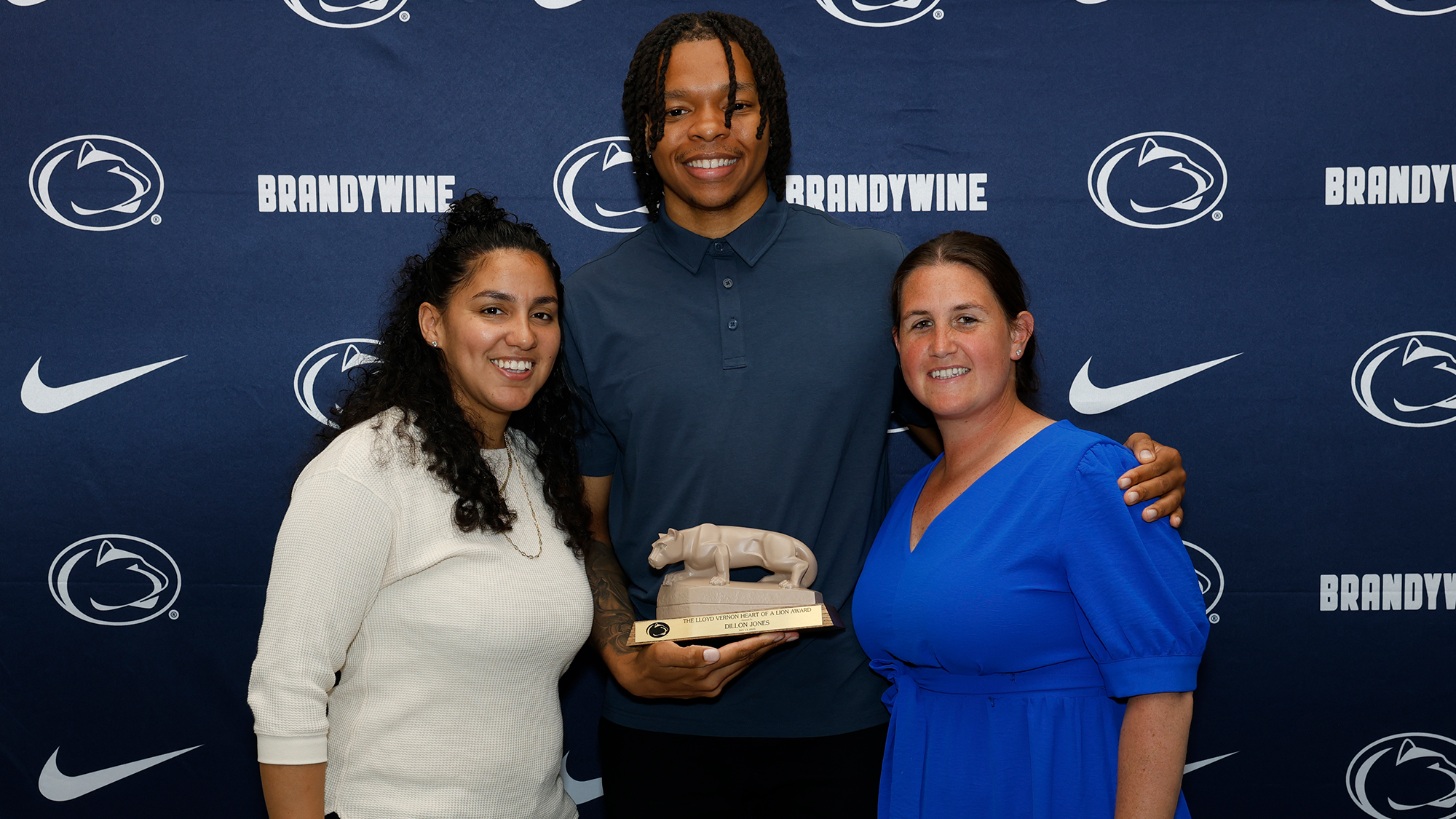 Recruiting Coordinator Myeisha Matos and Athletic Director Bobbi Caprice with Heart of a Lion award winner Dillon Jones