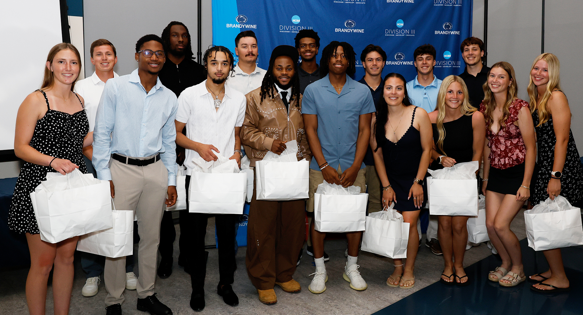 group of students with white bags
