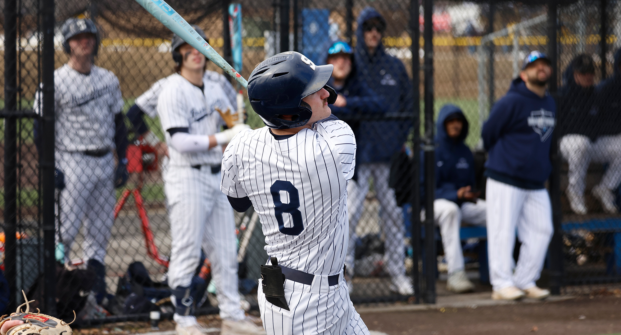 Baseball player swinging bat
