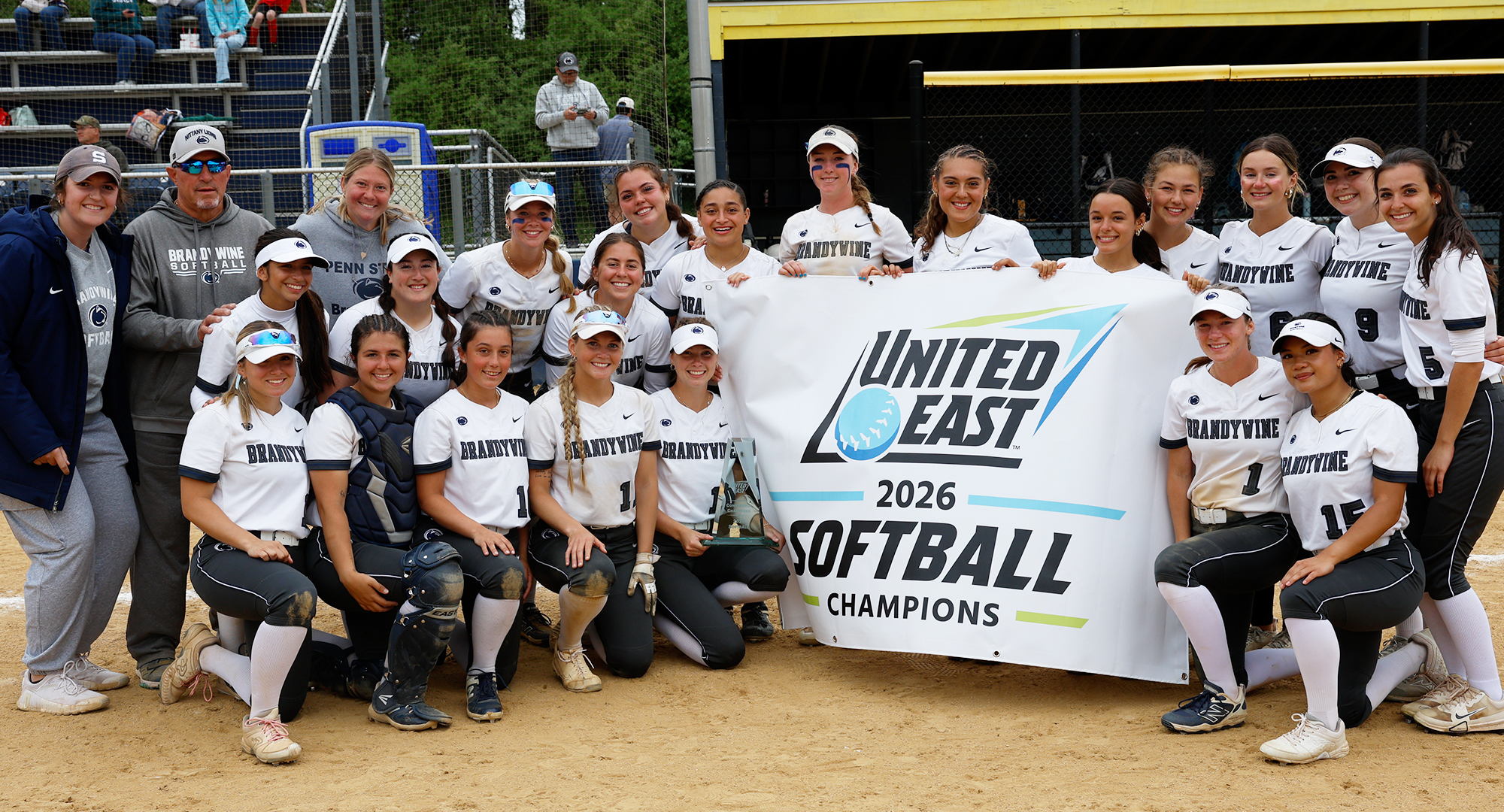 championship softball team with banner
